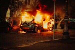 rioters burning police cars